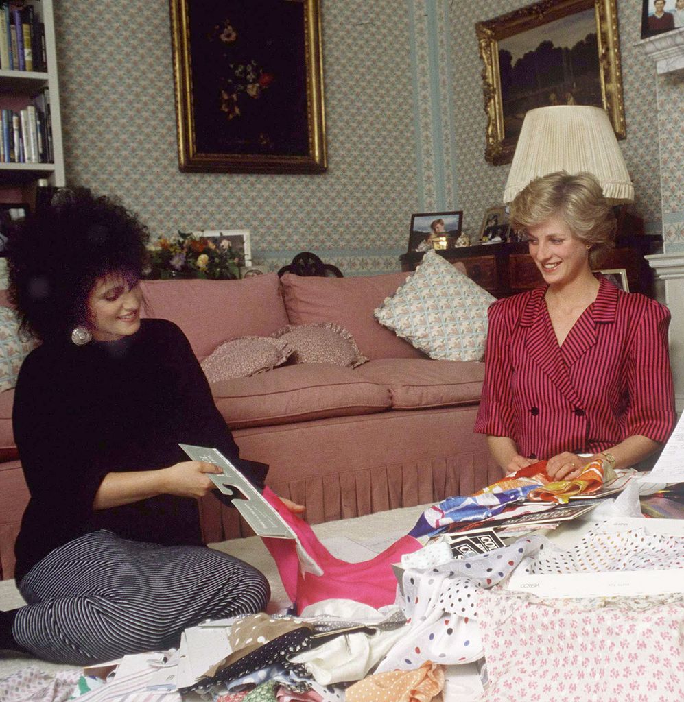 Elizabeth Emanuel with Diana in her sitting room in 1986 looking at fabrics for a royal tour