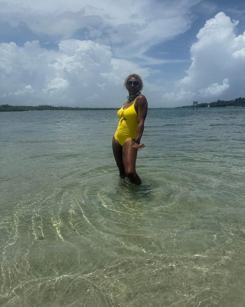 Serena William posing in yellow bikini in ocean