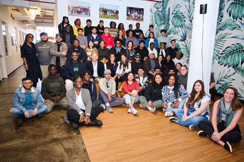 Harry and Meghan pose with students at Meghan and Harry during a roundtable at  The Marcy Lab School in Brooklyn, New York.