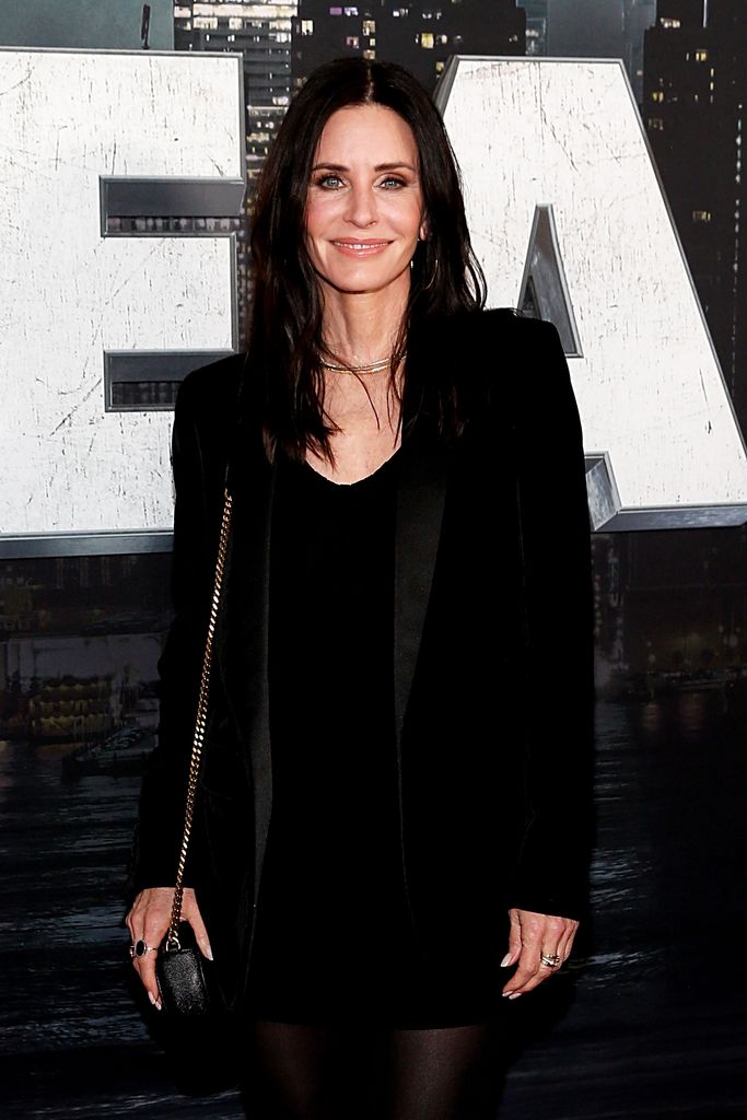 Courteney Cox smiling at a red carpet event