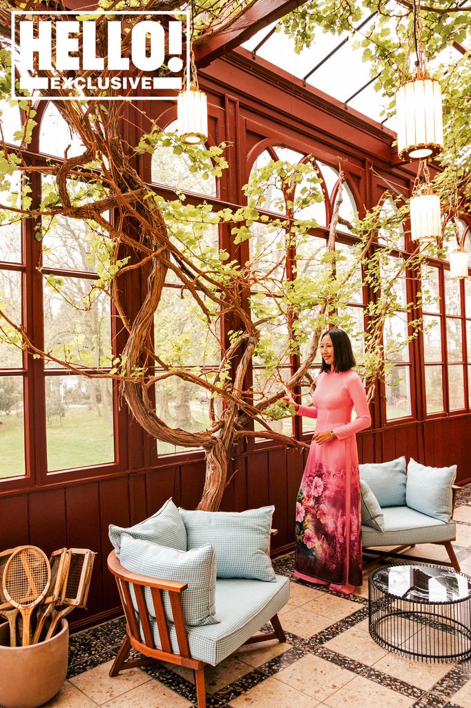 Woman in a pink dress in an orangery