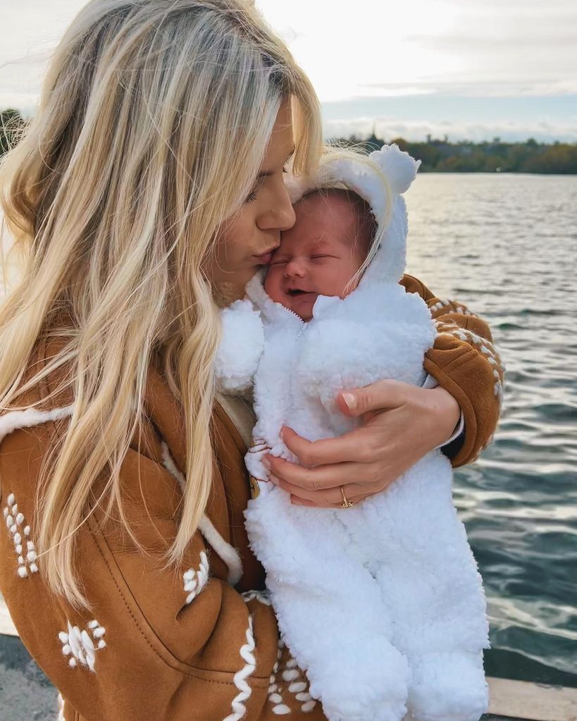 mollie king kissing newborn Annabella 