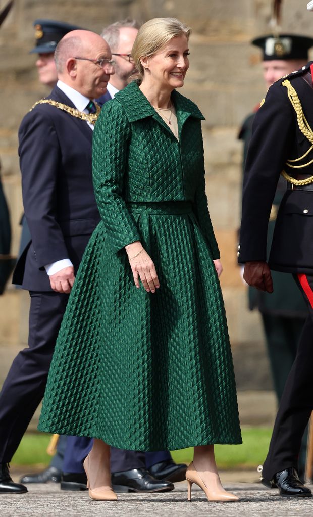 Sophie, Duchess of Edinburgh smiling in green jacket and skirt