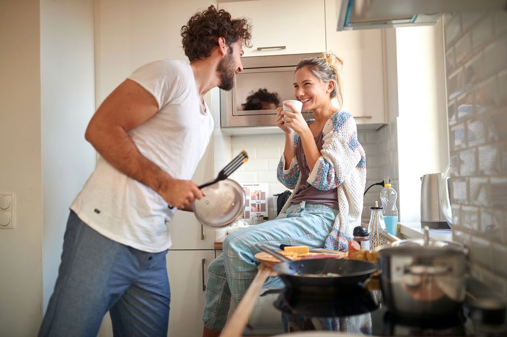 couple getting along in kitchen