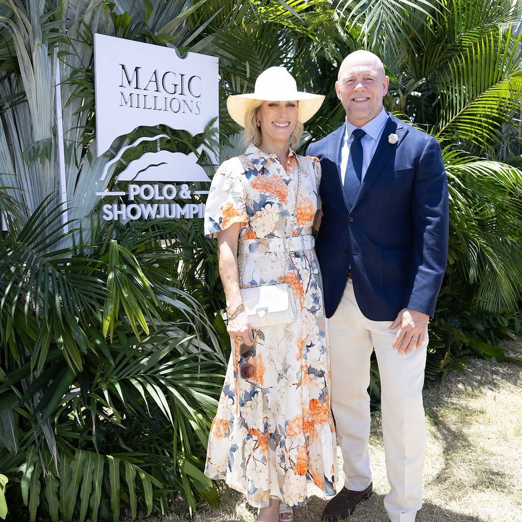 Zara Tindall wears a white gown decorated with orange florals, as her husband Mike Tindall wears cream chinos and a blue blazer