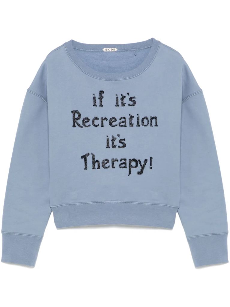 blue sweatshirt saying ;if it's recreation it's therapy'