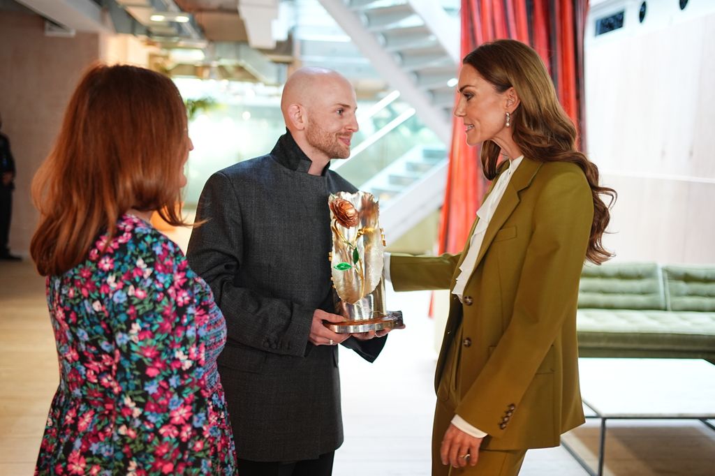 kate presenting award to designer