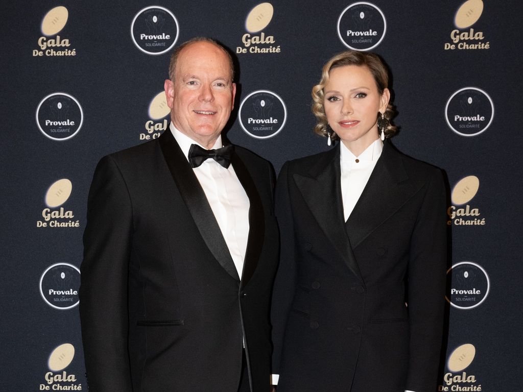 Princess Charlene and Prince Albert wear matching black suits at a charity gala in Paris