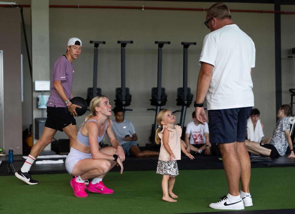 Keely Hodgkinson with her coach Trevor Painter and his daughter