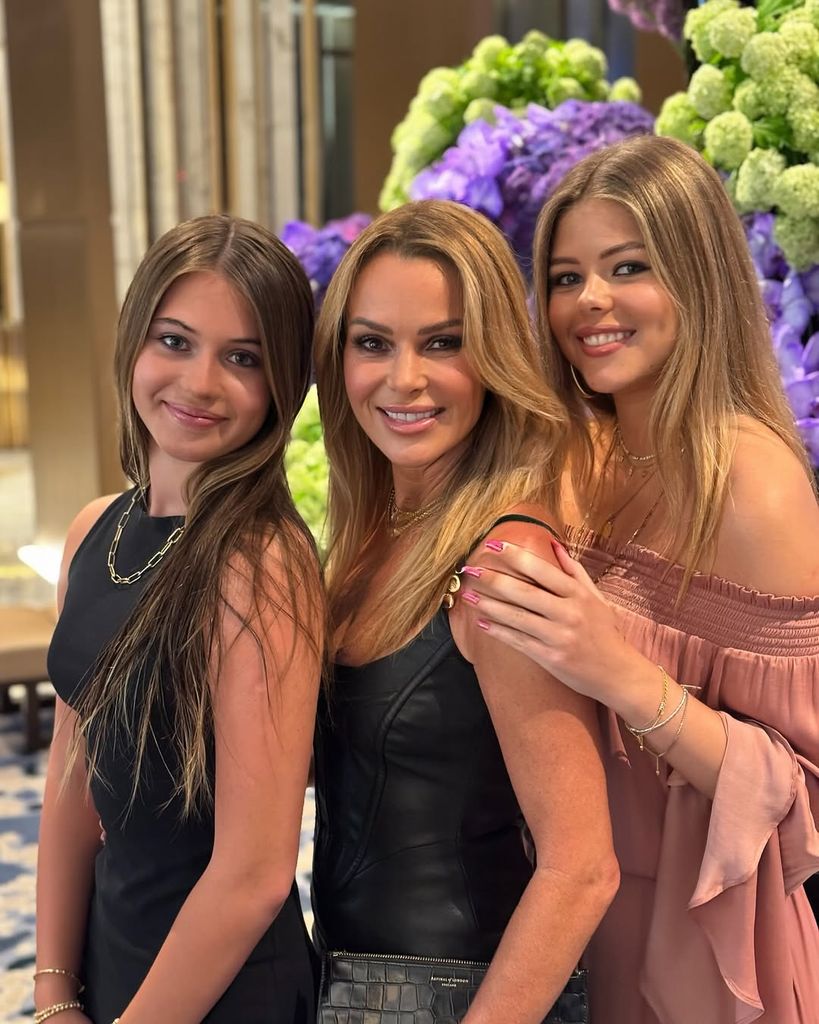Amanda Holden posing for a photo with daughters Hollie and Lexi