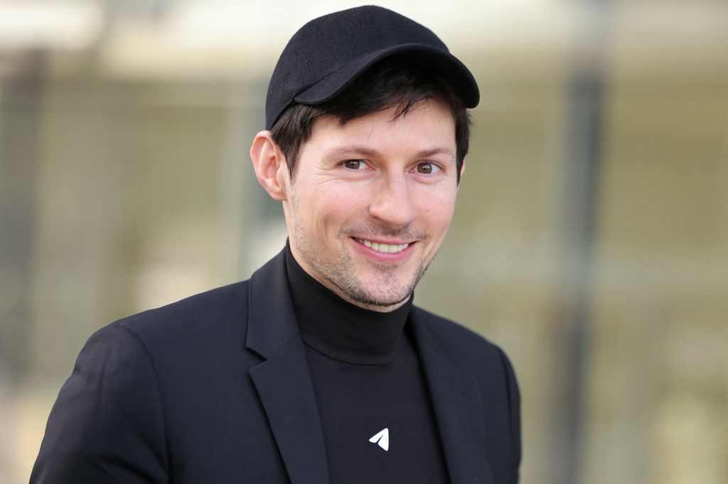 Pavel Durov smiling wearing a hat