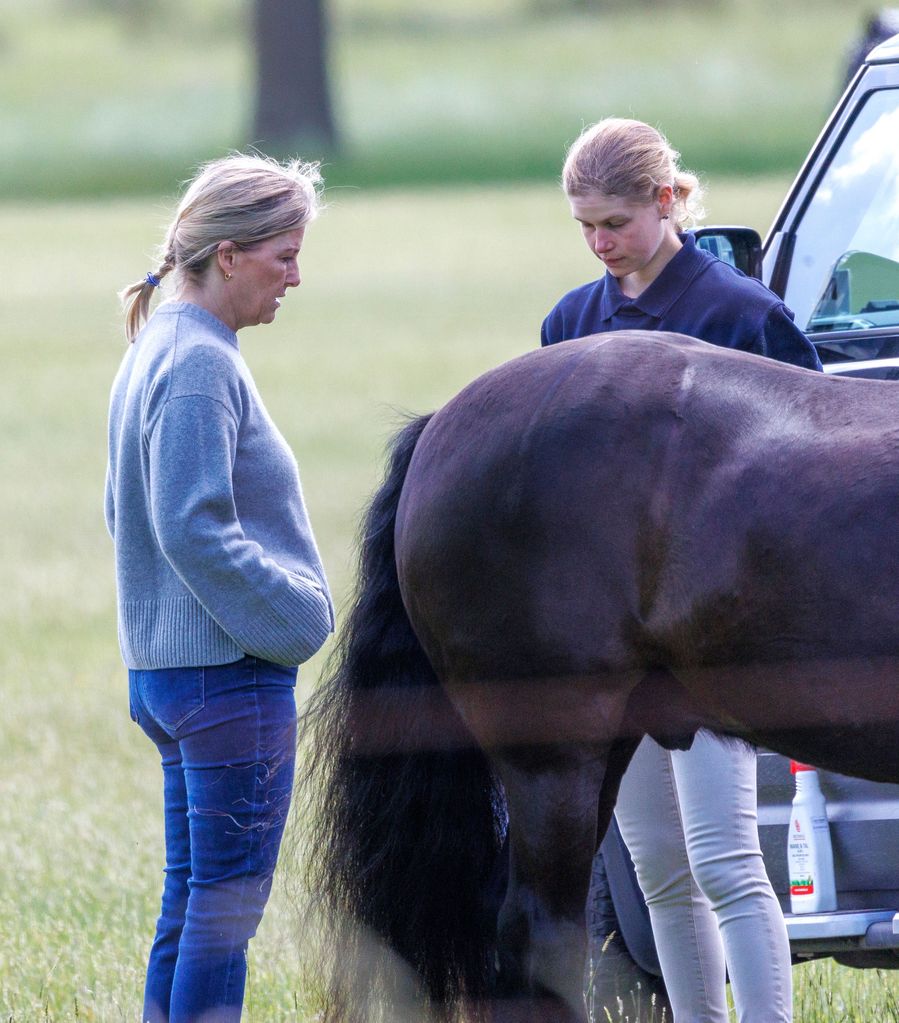 Lady Louise Windsor and Duchess Sophie and a horse looking serious chatting
