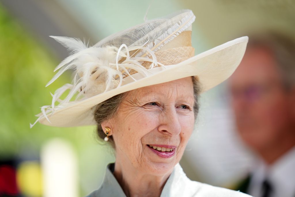 The Princess Royal smile for photo wearing smart dress and hat ahead of a trophy presentation following the St James's Palace Stakes during day one of Royal Ascot