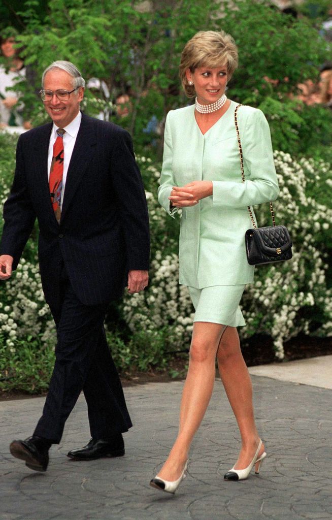 Princess Diana wearing a green suit and Chanel sling back shoes