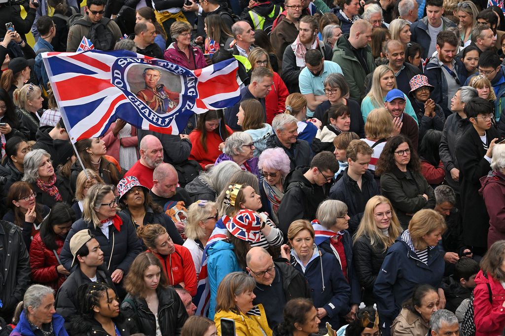 Well-wishers line the route of the 'King's Procession', a two kilometres stretch from Buckingham Palace to Westminster Abbey