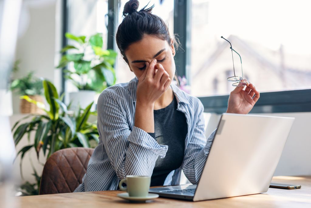 woman working on computer who needs a break.