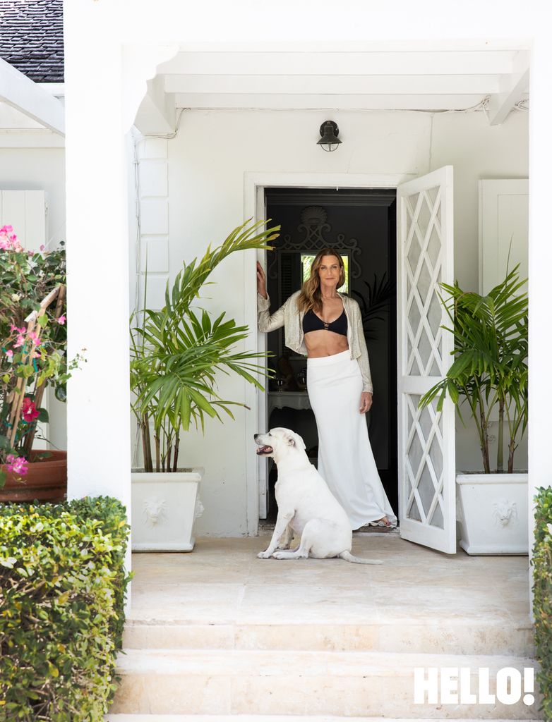 Woman in tropical setting with dog