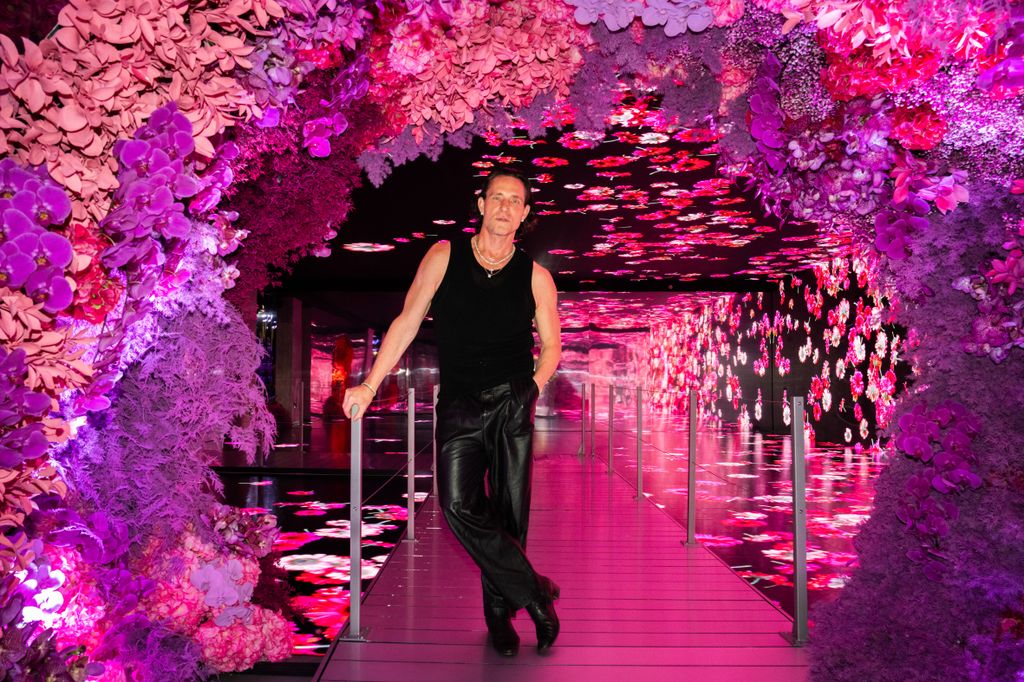 Jeff Leatham poses inside BLOOMTANICA an immersive floral experience Genesis House NYC 