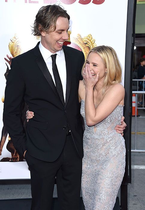 Kristen Bell laughing with Dax Shepard on the red carpet