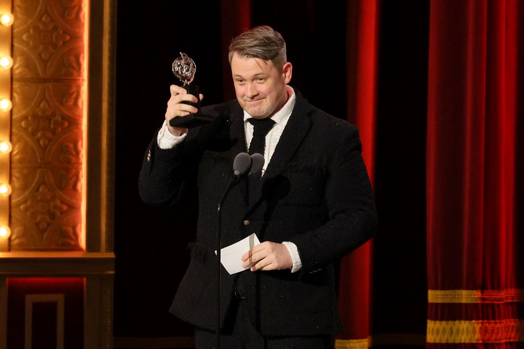 Michael Arden accepts the award for Best Direction of a Musical for "Parade" onstage during The 76th Annual Tony Awards at United Palace Theater on June 11, 2023 in New York City