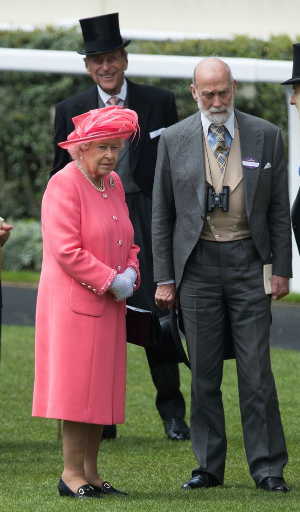 Prince Michael of Kent standing with the Queen, Prince Philip in a top hat is in the background