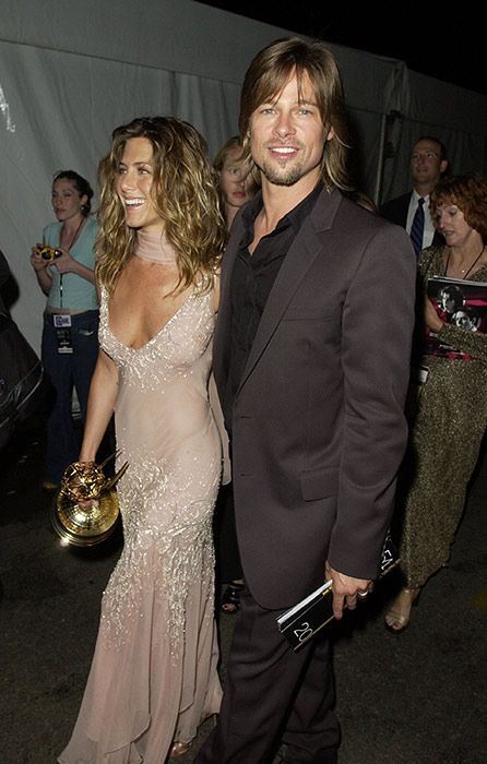 Jennifer Aniston wearing a long sparkly dress with Brad Pitt at the Emmy awards