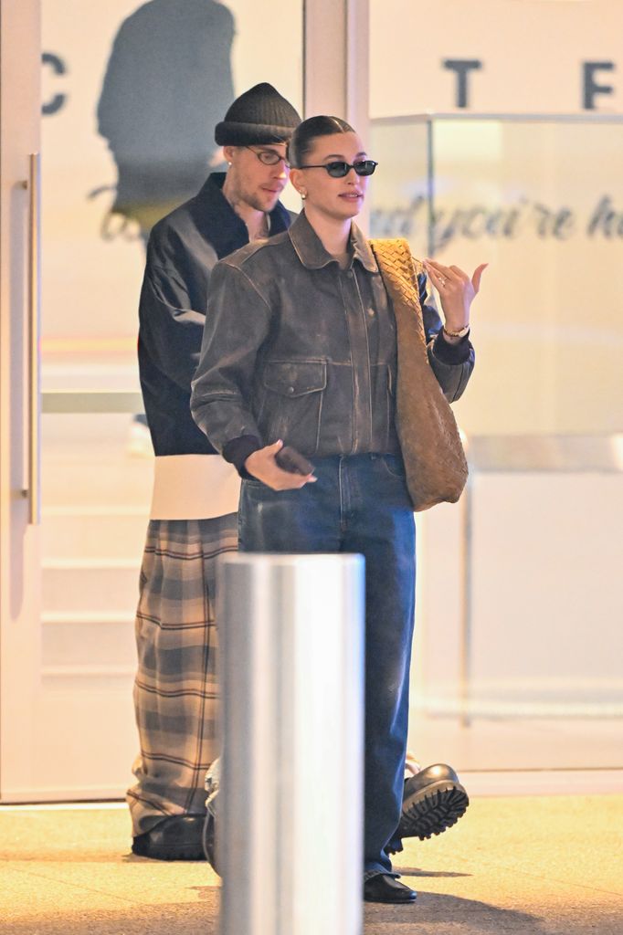 The couple appeared in high spirits as they walked through a shopping mall together