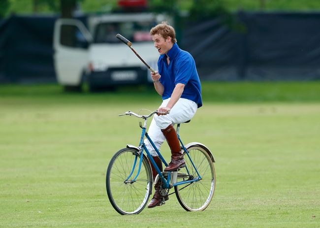 Prince William cycling with a polo stick