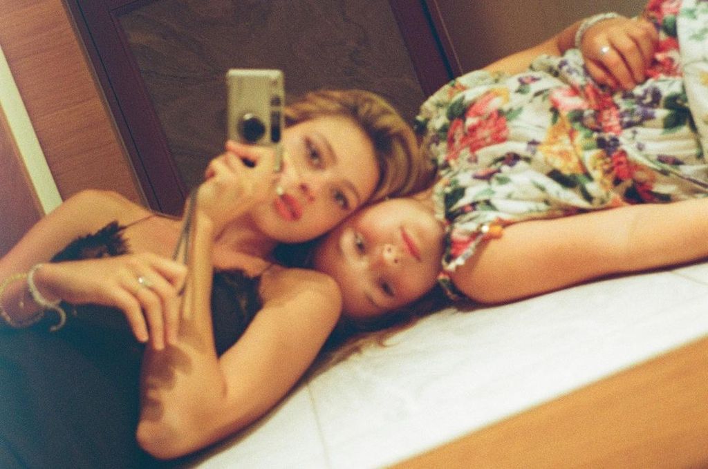 Nicola Peltz and Harper Beckham life on the floor and take a selfie together