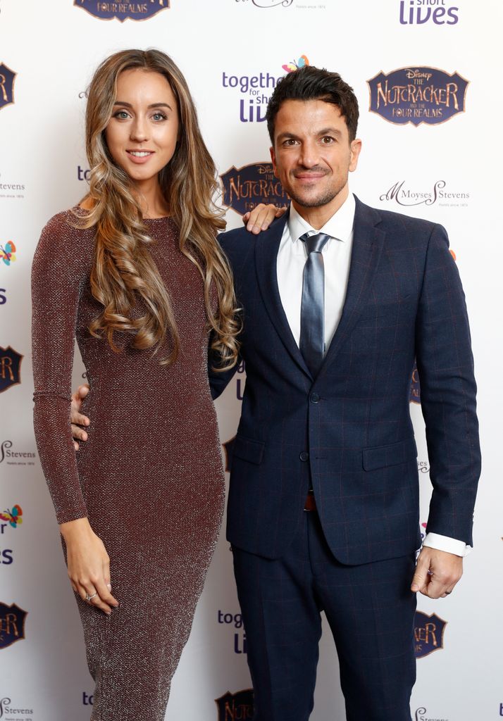 Peter and Emily Andre attending a press event