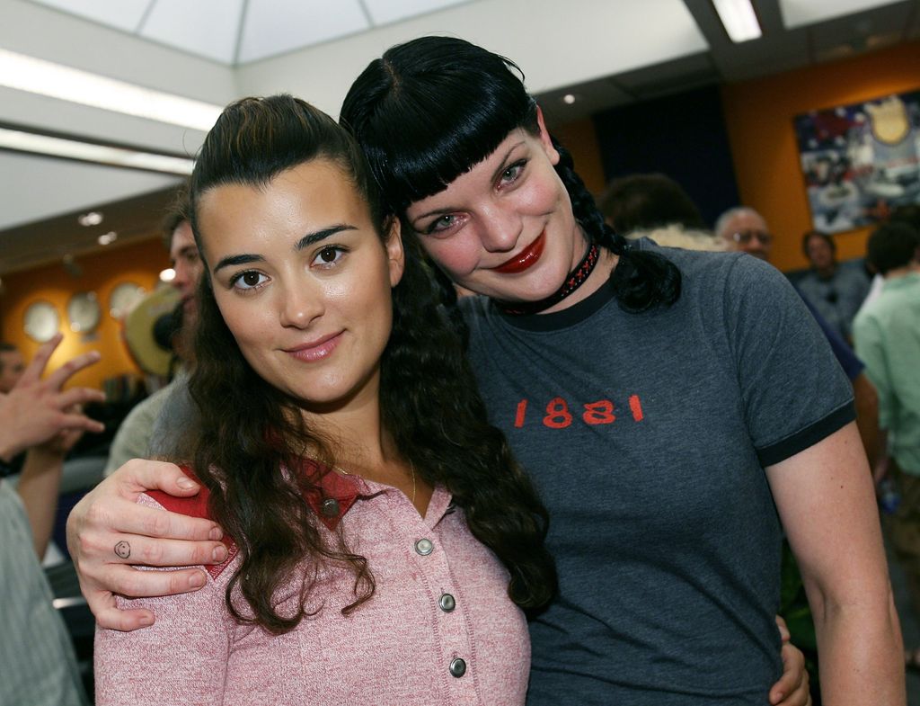 Cote de Pablo and actress Pauley Perrette attend the NCIS 100th Episode celebration 