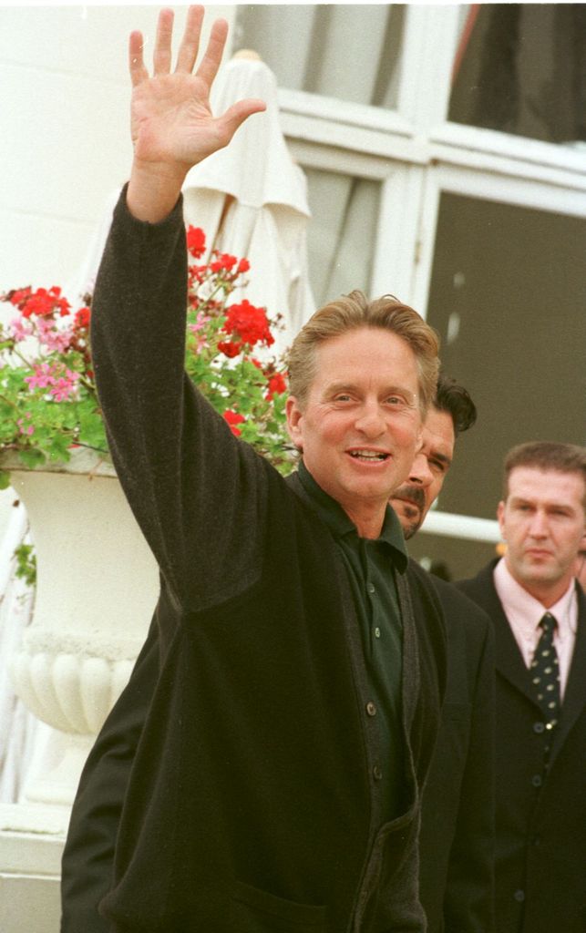 Michael Douglas waves to fans in 1998 at the Deauville Film Festival