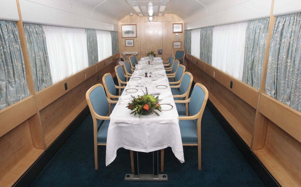 A long dining table on board the royal train