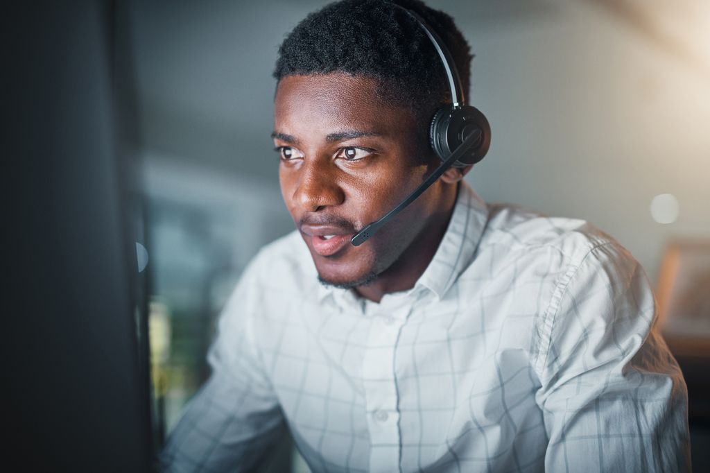 man using headset and desktop