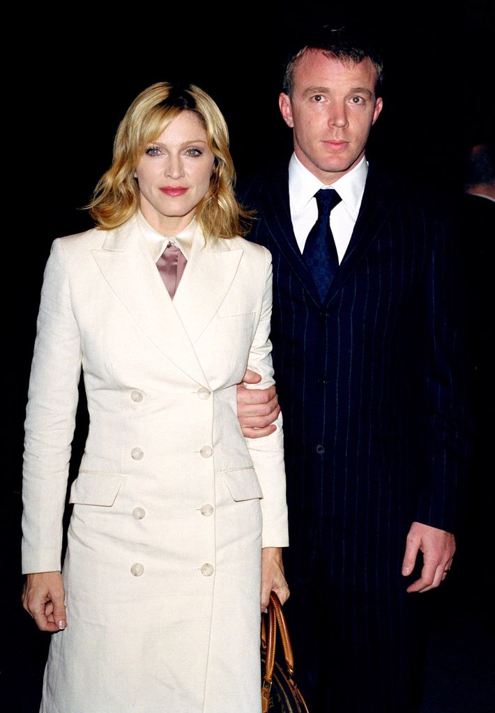 Madonna and Guy Ritchie smiling at an event