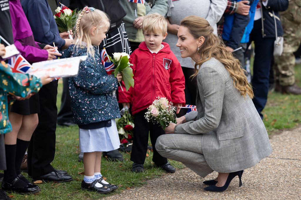 Kate speaking with children 