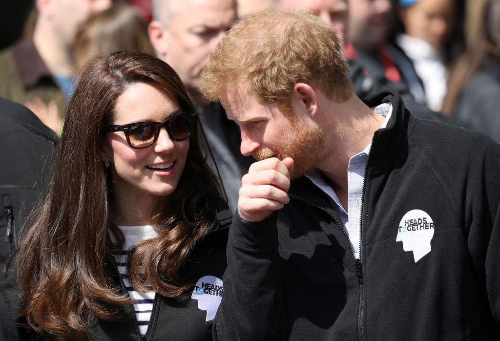 A photo of Prince Harry chatting to Princess Kate