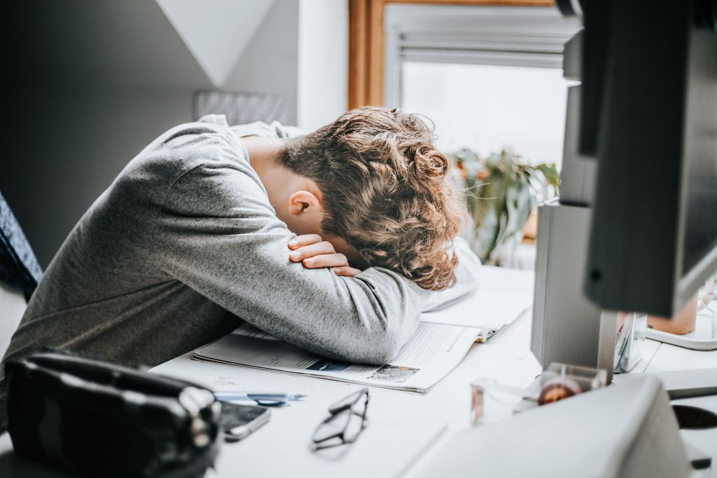 stressed student head on desk
