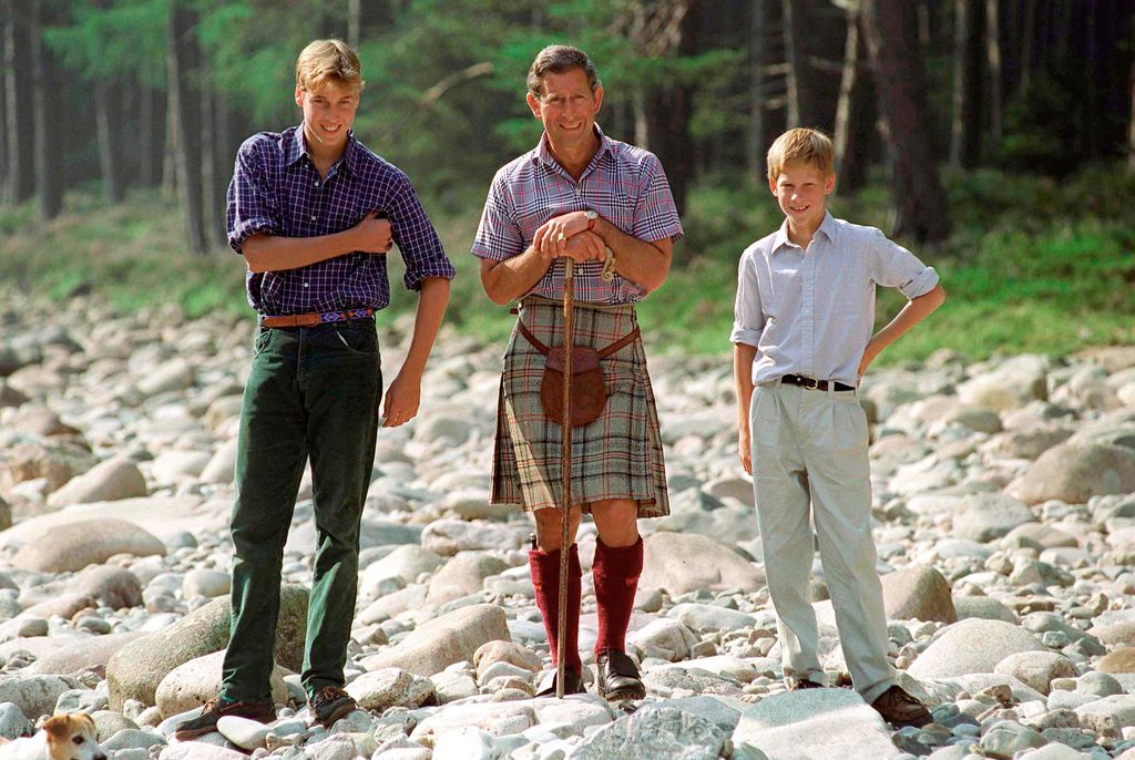 Charles wearing a kilt with Harry and William in Scotland in 1997