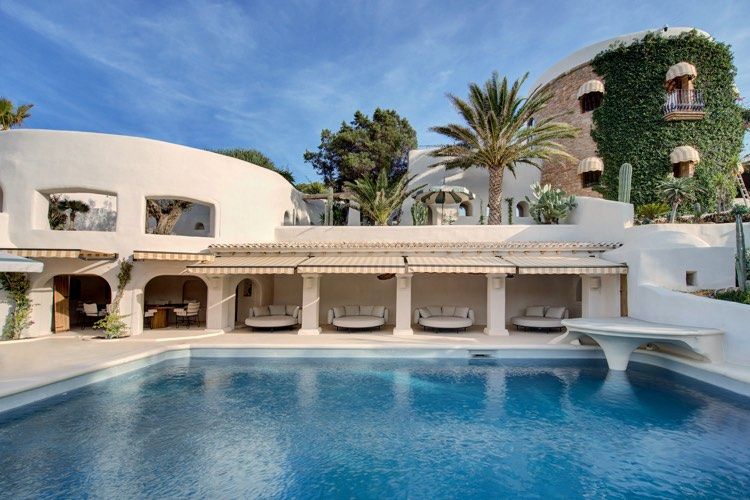 Fincadelica Xarraca pool with cabanas in Ibiza 