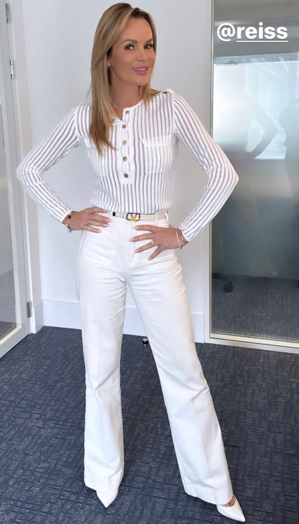 Amanda Holden wearing an all-white outfit from Reiss