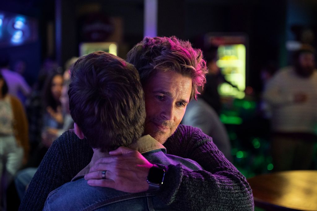 Rob Lowe as Ellis hugs Jackson Dragon in Unstable