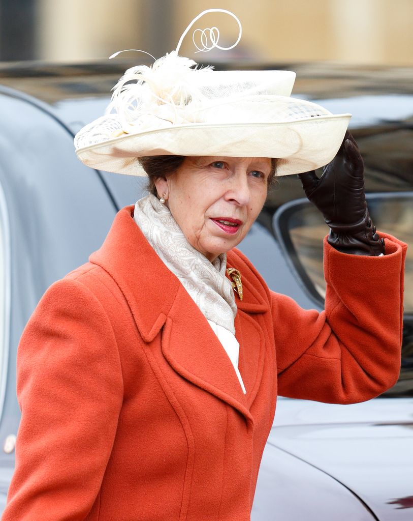 Princess Anne wears an orange coat