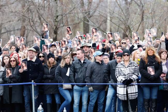 Fans outside of Graceland during Lisa Marie Presleys funeral