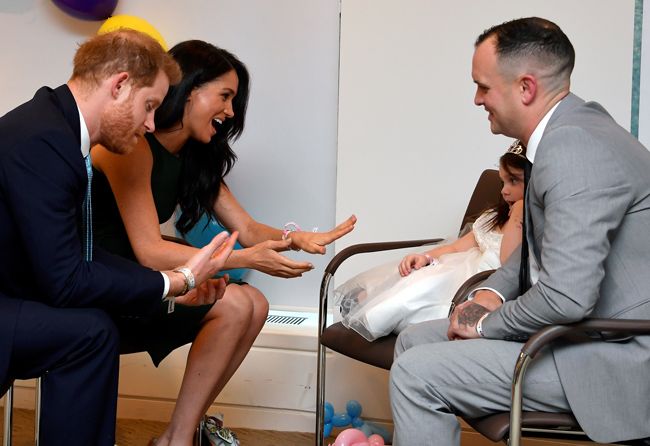 the duke and duchess of sussex are given bracelets by lyla rose odonovan and her father paul  