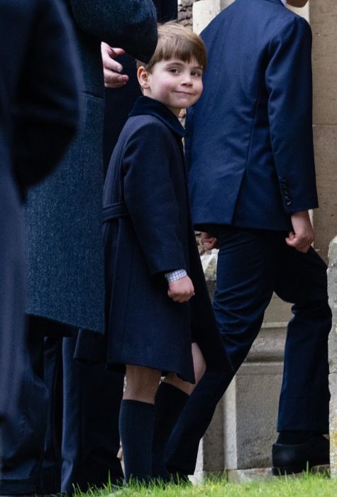 prince louis smiling outside of church