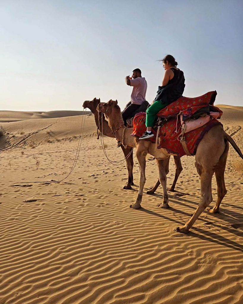 Rishi Nair and girlfriend Natali riding camels in India