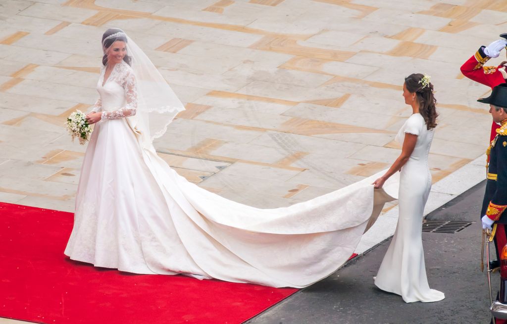 Kate Middleton with her sister Pippa Middleton carrying her veil at the royal wedding in 2011