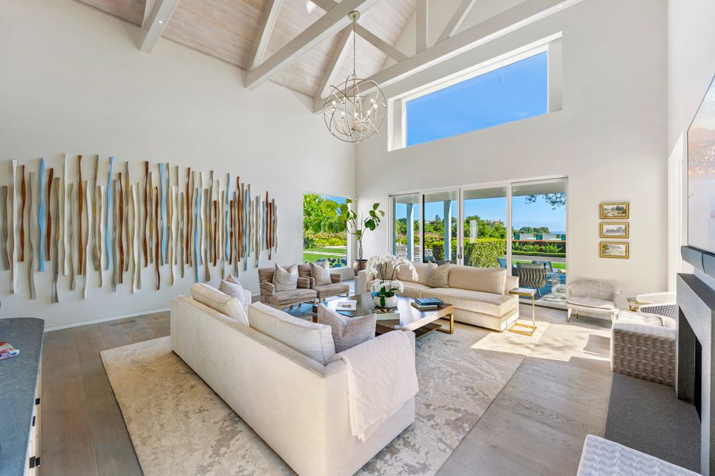 The double height ceiling adds grandeur to the living space