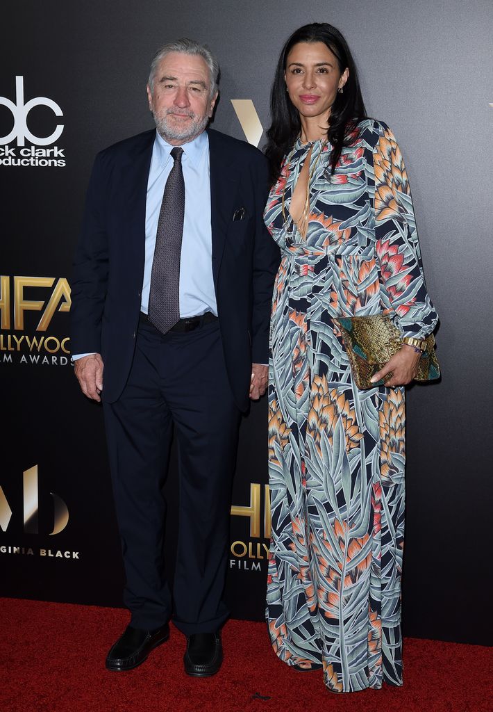 Robert De Niro smiling on the red carpet with his daughter, Drena De Niro in 2016